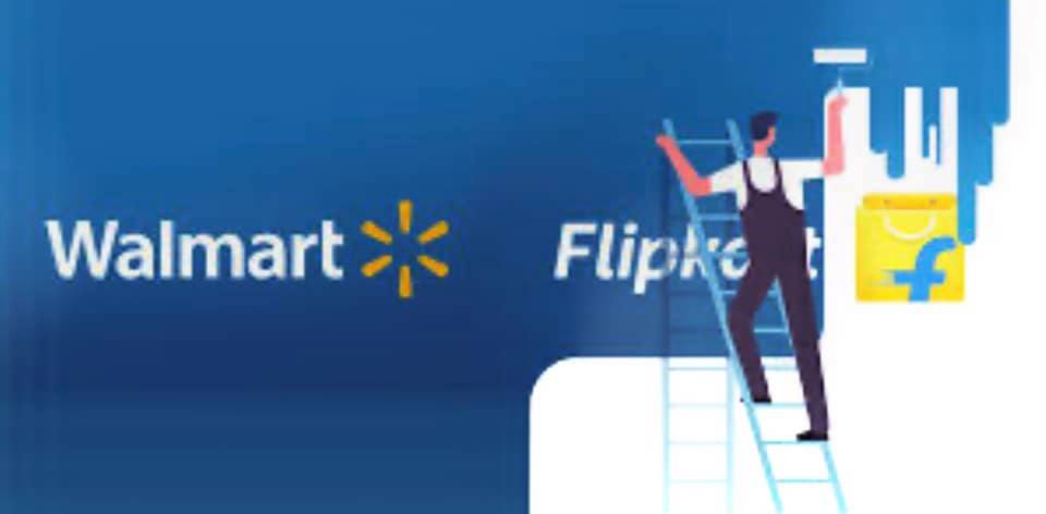 A painter covers up the name Flipkart with a Wal-mart logo